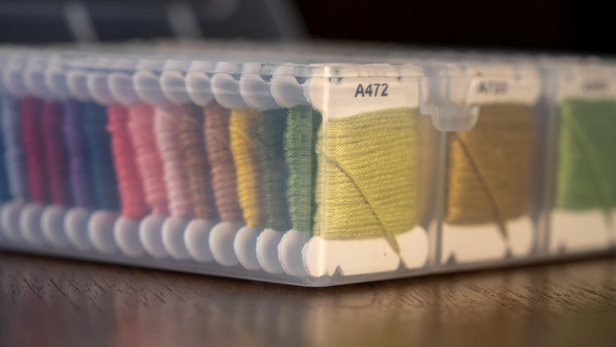 Stack of embroidered samples and swatches
